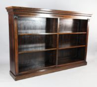 A William IV rosewood open bookcase, with adjustable shelves, turned mouldings and stylised leaf