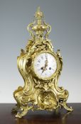 A French gilt brass Louis XVI style mantel clock, with enamelled Arabic dial, countwheel movement