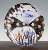 A Japanese Imari scalloped dish, by Fukugawa, Meiji period, painted with carp in a pond and irises
