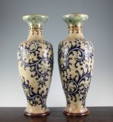 A pair of large Doulton Lambeth stoneware baluster vases, c.1907, modelled by George Tinworth with