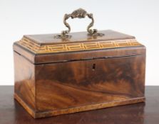 An early 19th century rectangular yew wood tea caddy, with internal lidded compartments and brass