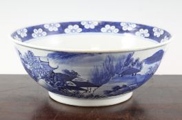 A Chinese blue and white bowl, late 19th century, painted with figures in a river landscape scene