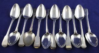 Two sets of six George III/IV silver fiddle pattern dessert spoons, both with engraved initials,