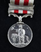 An 1858 India Mutiny medal with Central India clasp to Wm Douglass, 71st Highland Light Infantry