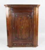 A George III mahogany corner cupboard, boxwood and ebony line inlaid decoration, with single door,