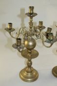 A pair of Dutch 17th century style five branch candelabra, with central drip pans and circular
