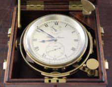 A Thomas Mercer 2½ day marine chronometer, the silvered Roman dial with state of wind indicator