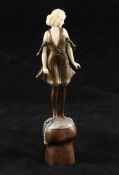 Professor Otto Poertzel. An Art Deco bronze and ivory figure, `Champagne Girl`, modelled as a