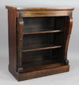 A Regency rosewood open bookcase, with adjustable shelves, carved and scrolling uprights, on