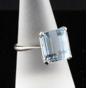 An 18ct white gold and solitaire aquamarine ring, the rectangular stone measuring 11.5mm by 12.