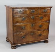 An 18th century walnut chest, of three short and three long drawers on bun feet, W.3ft 3.5in.