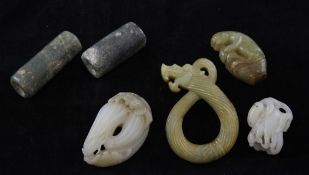 A group of six Chinese jade and bowenite carvings, comprising a white and brown jade carving of a