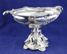 An ornate 1930`s silver centrepiece, of shaped oval form, decorated with floral festoons, with