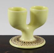 A rare Troika double egg cup, decorated by Alison Brigden, with pale egg yolk yellow glaze, the