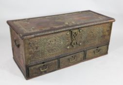 A 19th century teak and brass mounted Zanzibar chest, with hinged lid and three base drawers, W.