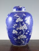 A large Chinese blue and white ovoid jar and cover, late 19th / early 20th century, painted with