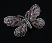 A 1960`s/1970`s 18ct white gold, ruby and diamond set trembleuse butterfly brooch, width 3in.