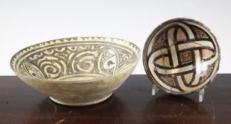 Two Kashan pottery bowls, 13th / 14th century, the first decorated in green and black glaze with