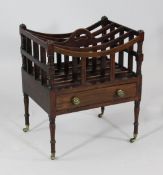 A 19th century mahogany four division canterbury, with single drawer, turned legs and caster feet,