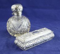 A George V repousse silver mounted cut glass scent bottle with stopper, of globular form, Martin