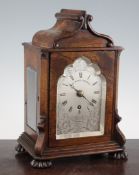 An early Victorian rosewood mantel timepiece, with architectural case and gothic arched silvered