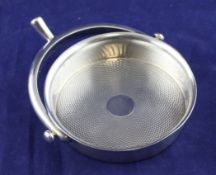 An early 20th century French 950 standard silver coaster, retailed by Hermes with prong handle and
