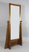 Robert `Mouseman` Thompson. An oak cheval mirror, with tapering shaped sides and basketweave pierced