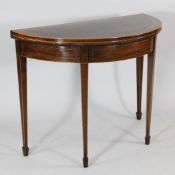 A 19th century mahogany satinwood demi lune folding card table, the marquetry inlaid border with