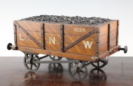 A Victorian novelty `coal tender` humidor, with LNW livery, with oak body and brass undercarriage,