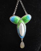 An Art Nouveau sterling silver, two colour enamel and mother of pearl drop pendant necklace, stamped