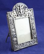 A late 19th/early 20th century Dutch silver photograph frame, of rectangular form with domed top and
