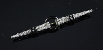 A stylish French Art Deco 18ct gold, diamond and black onyx set brooch, signed J. Marchak, Paris,