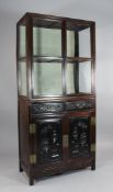 An early 20th century Chinese huang huali wood display cabinet, with a pair of glazed doors over