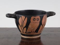 A Greek red-figure `owl` skyphos, Southern Italy, c.4th century B.C., 5.5in. - repaired Starting