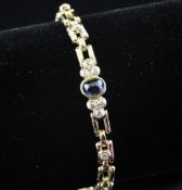 A 14ct gold, cabochon sapphire and diamond set bracelet, gross 15.2 grams. Starting Price: £560