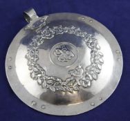 An early 20th century Arts & Crafts planished silver hand mirror, by the Potteries Guild of