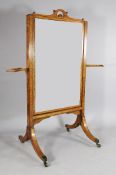 A George III satinwood and rosewood crossbanded standing cheval mirror, with downswept legs,