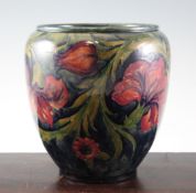 A Moorcroft `Spanish` ovoid vase, c.1916, on mottled blue green ground, inscribed `W Moorcroft`