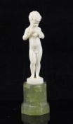 Ferdinand Preiss (1882-1943). An Art Deco carved ivory figure of a small boy holding a canary, on an