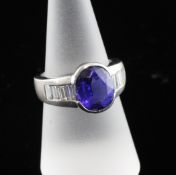 A Schwartz 18ct white gold, tanzanite and diamond dress ring, with oval cut stone and graduated