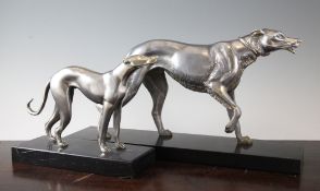 Irene Rochard. An Art Deco silvered bronze figure of a hound, on black marble base, signed, together