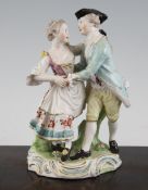 A Derby porcelain group of dancers, c.1775, each wearing 18th century dress, on scrollwork base, pad