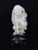 A Chinese pale celadon jade figure of a standing man, 18th / 19th century, holding a gourd and