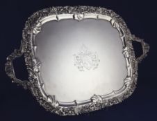 A George III silver two handled tea tray, of rounded rectangular form, with engraved armorial and