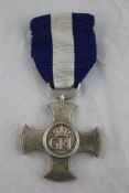 An unattributable George VI Distinguished Service Cross dated 1943. Starting Price: £160