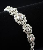 A Victorian style 14ct gold and old cut diamond set bracelet, with five graduated clusters of