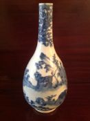 A Chinese blue and white bottle vase, Kangxi mark, late 19th century decorated with a tiger,