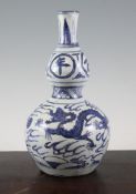 A Chinese Ming blue and white double gourd vase, 16th century, painted with two five claw dragons