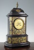 A mid 19th century French red boullework and ebonised mantel clock, with gilt Roman dial signed