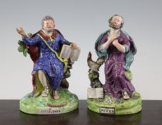 Two Pearlware figures of St Paul and St Peter, c.1820-30, the former seated and holding a copy of